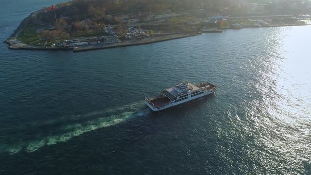 Ships floating Bosphorus blue water sunny day. Aerial drone view on sunset in Istanbul, Turkey