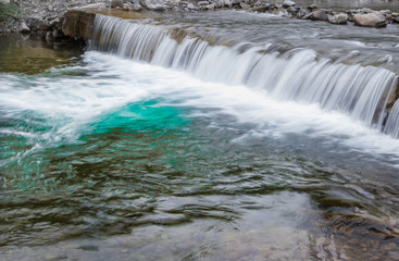 Obraz premium a mountain stream in the Carpathian mountains. Beautiful view of the Carpathians