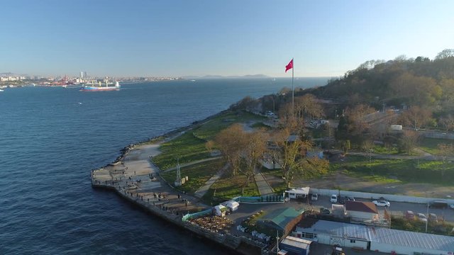 Ships floating Bosphorus blue water sunny day. Aerial drone view on sunset in Istanbul, Turkey