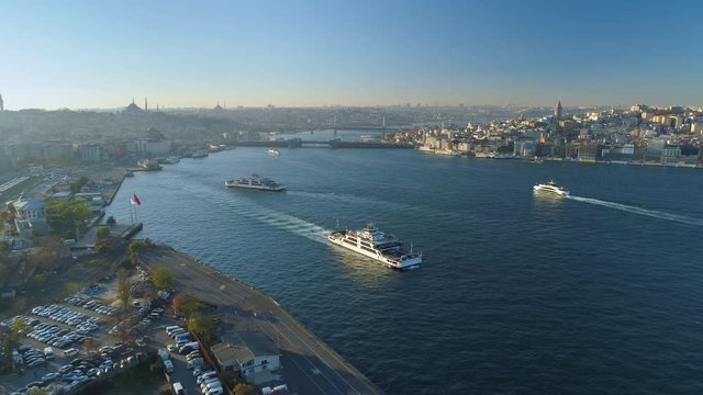 Ships floating Bosphorus blue water sunny day. Aerial drone view on sunset in Istanbul, Turkey