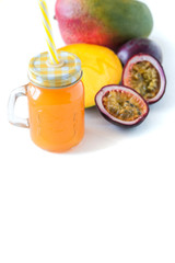 mango and passion fruit juice in a glass jar. Isolate
