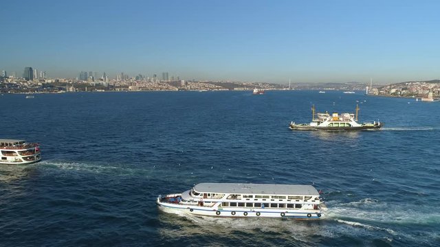 Ships floating Bosphorus blue water sunny day. Aerial drone view on sunset in Istanbul, Turkey
