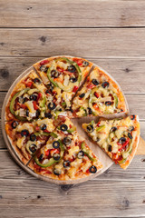Delicious italian pizza served on wooden table