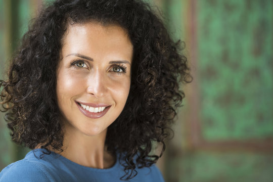 Portrait of smiling woman with curly hair