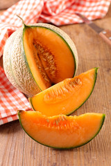 fresh melon on wood background © M.studio