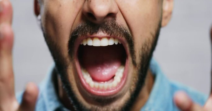 Facial Expressions Of Young Beard Man On Brick Wall