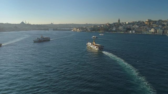 Ships floating Bosphorus blue water sunny day. Aerial drone view on sunset in Istanbul, Turkey