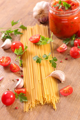 raw spaghetti and tomato sauce