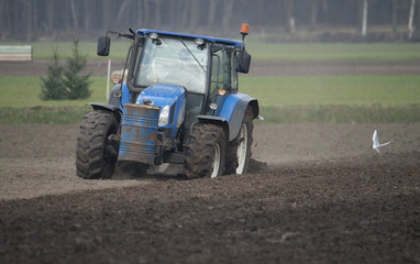 Fototapeta na wymiar farmer plowing a field