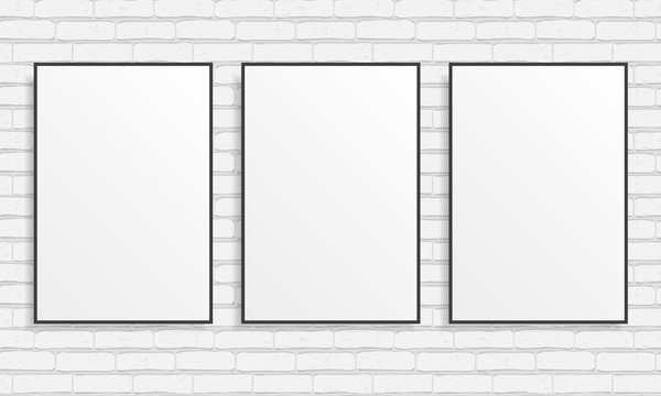 Three blank posters on white brick wall. Vector template