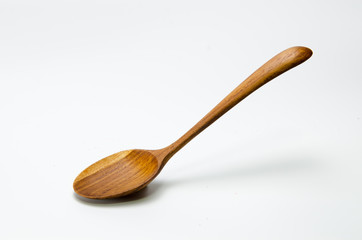 Wooden spoon on white background