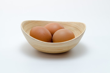 Eggs in brown bowl