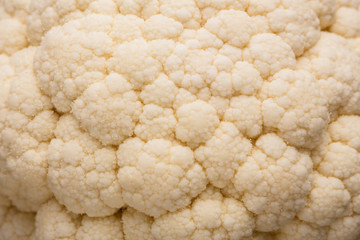 fresh cauliflower on a rustic wooden background