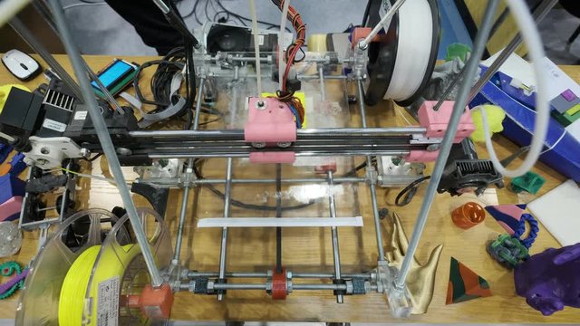 working 3d printer sequence. Three dimensional printer during work in school laboratory, 3D plastic printer, 3D printing