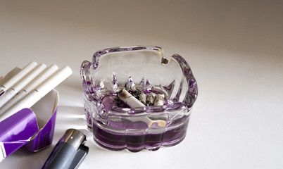 cigarette  ashtray and lighter on white background