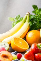 Fresh berries with assorted fruits. Colorful clean and healthy eating concept. Detox food. Copy space.