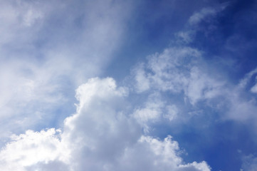 Fototapeta premium texture of a bright blue sky with a large cloud