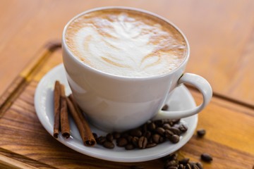Cup of cappuccino on table