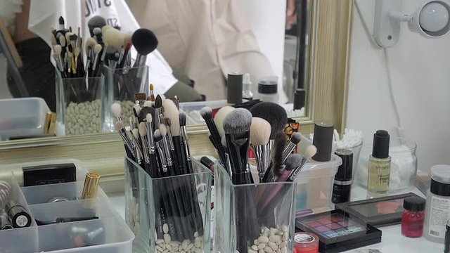A large set of makeup brushes in the studio