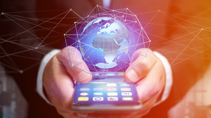 Businessman using smartphone with a Connected network over a earth globe concept on a futuristic interface - 3d rendering