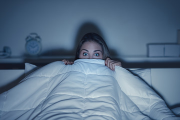 Woman watching an horror movie