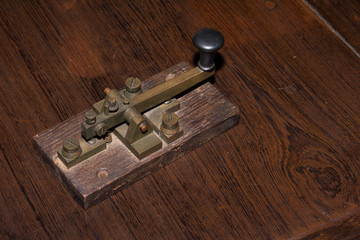 The old telegraph on wooden table