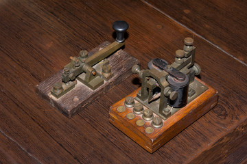 The old telegraph on wooden table