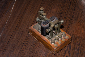 The old telegraph on wooden table