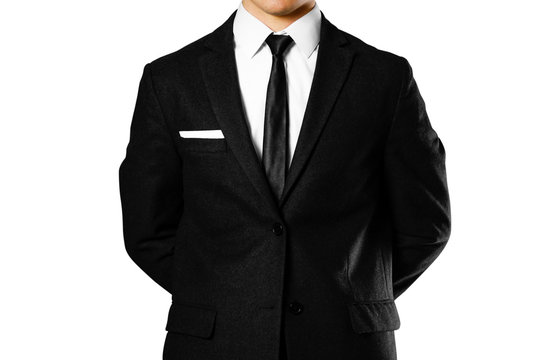 Businessman in a black suit, white shirt and tie. Studio shooting. Isolated on white background