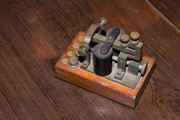 The old telegraph on wooden table