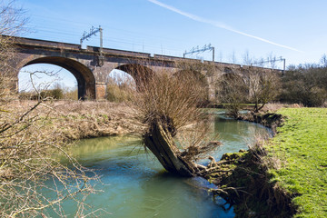 Narrow river under the railway bridge in early Spring - near Floodplain Forest in Milton Keynes - 2