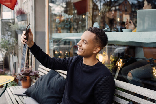 Young man taking selfie