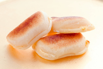 macro approach shot of marzipans in golden board