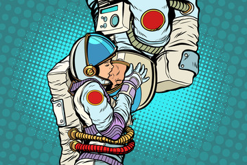 Kiss love couple male and female astronauts