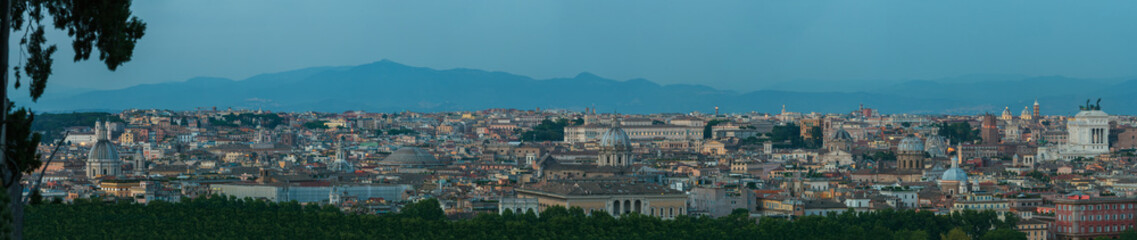 Twilight dusk urban skyline panorama of Rome with main architectural international landmarks from Janiculum hill viewpoint with famous Pantheon and Altare della Patria buildings