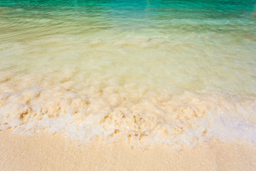 Wave of the sea on the sand beach