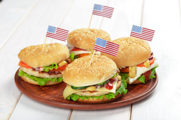 Fast food, homemade burger on a wooden background