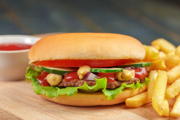 Fast food, homemade burger on a wooden background