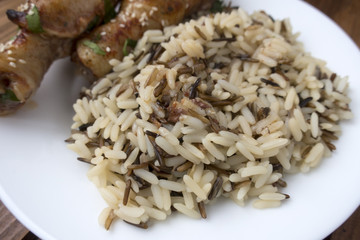 cooked rice with fried chicken legs