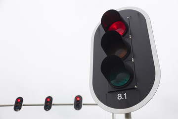 closeup of red traffic lights and overcast sky