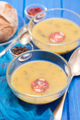 soup with spinach and smoked sausage in small bowls