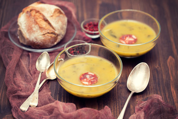 soup with spinach and smoked sausage in small bowls