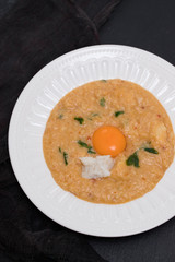 traditional portuguese dish bread with fish acorda on dish