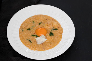 traditional portuguese dish bread with fish acorda on dish