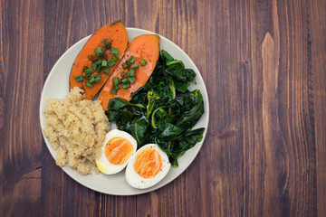 sweet potato with quinoa, boiled egg on plate
