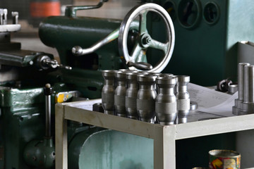 Metal part with a notch after turning on a rack near the machine