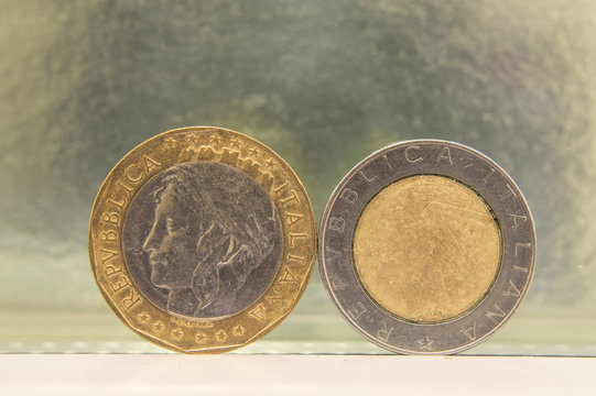 one thousand coin and five hundred Italian lire 
