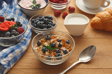 Rich breakfast on natural wooden table