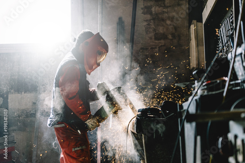 Side view of man working in workshop