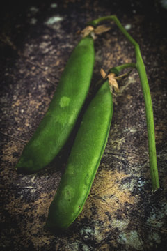  Close up peas on colorful table